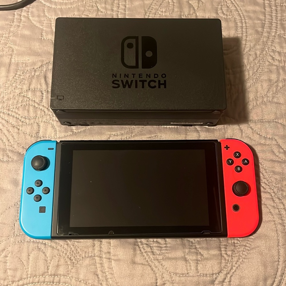 Nintendo Switch with charging stand and cords